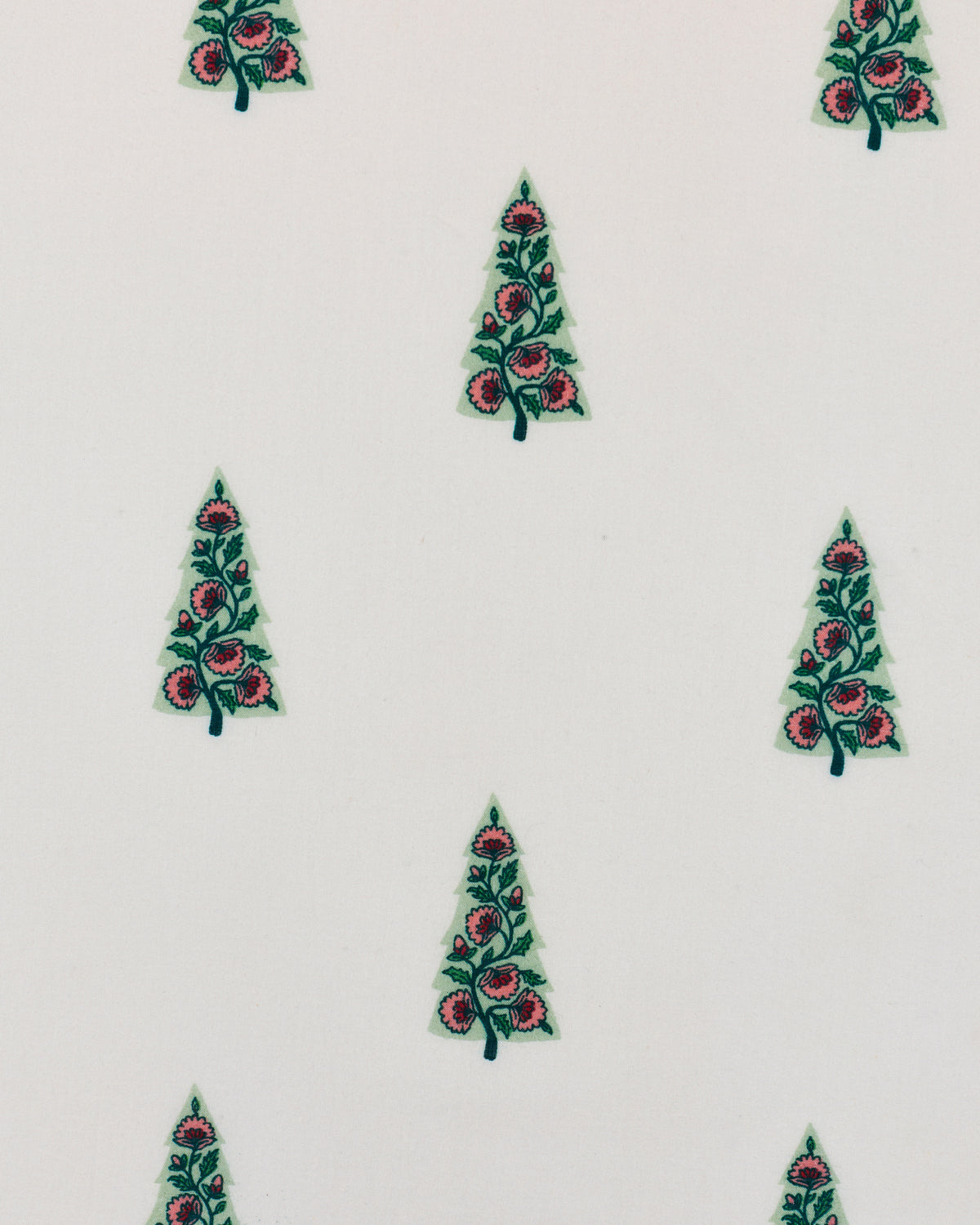 Close-up of the nightgown’s repeated floral tree print on a pale background.
