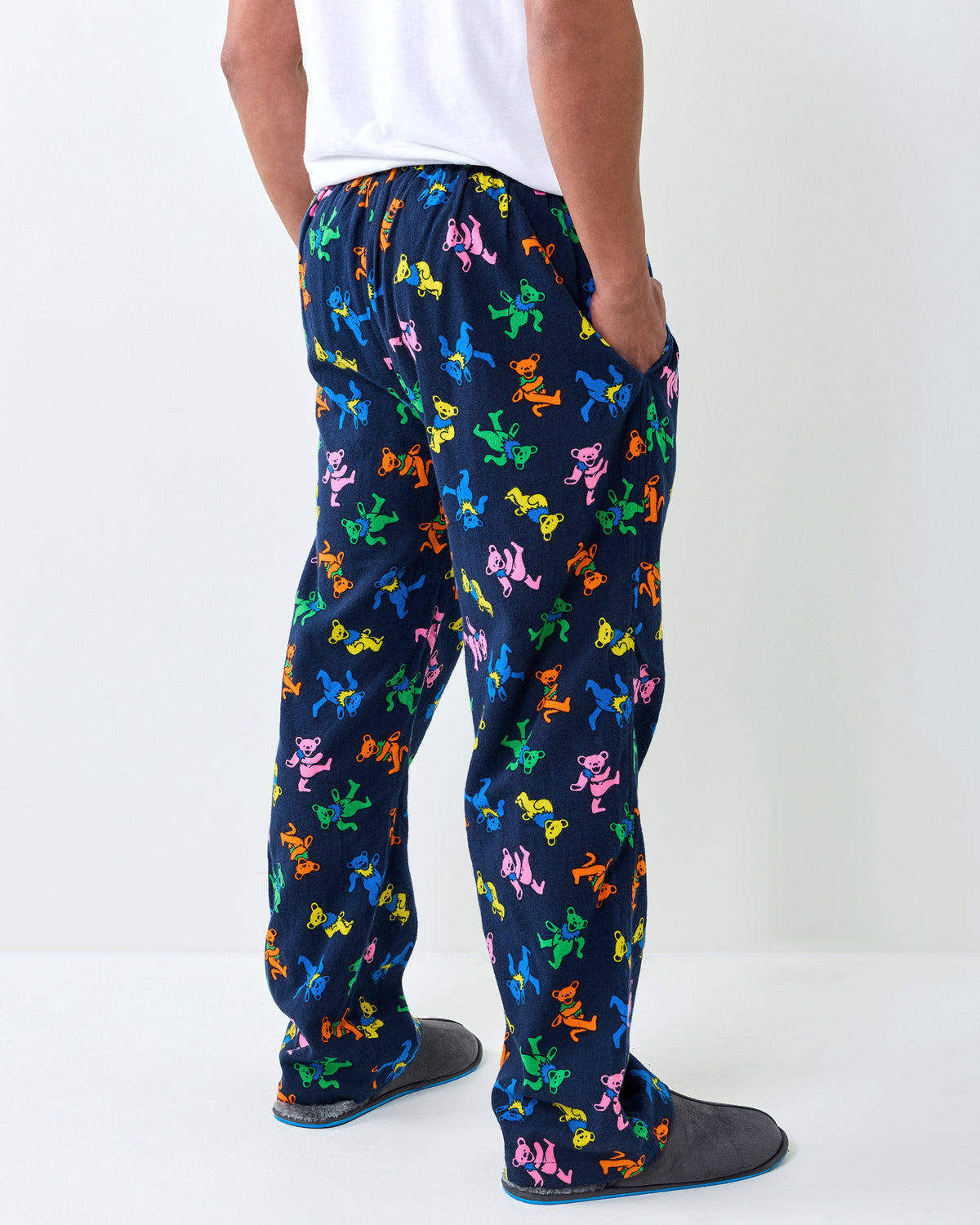 Rear angled view of the Dancing Bears long pajama pants, showing the colorful bear print and side pocket.