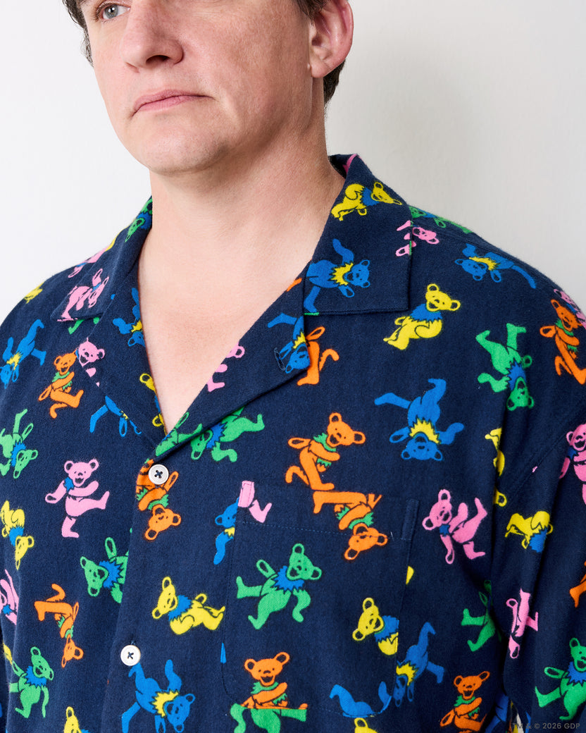 Close-up of the Dancing Bears men's pajama shirt collar, buttons, and printed fabric.