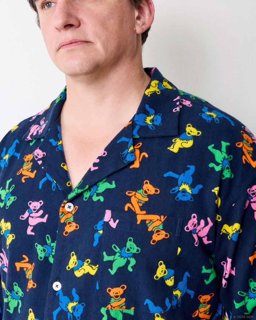 Close-up of the Dancing Bears men's pajama shirt collar, buttons, and printed fabric.
