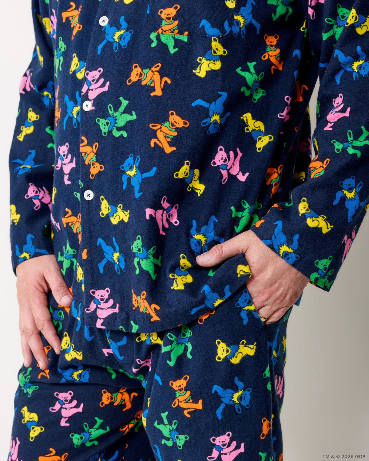 Close-up of the Dancing Bears men's pajama shirt pocket and matching pants print.