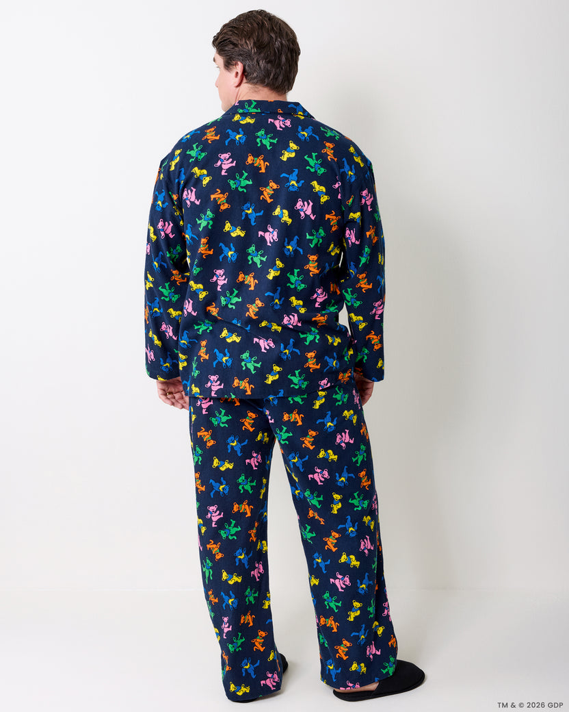 Back view of a person wearing the navy Dancing Bears long pajama set with colorful bear figures.