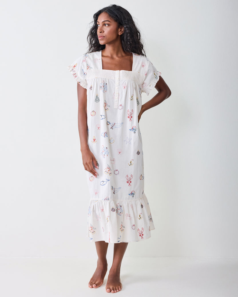 Front view of the Embroidered Yule Tides daylight nightgown with short ruffled sleeves and a lower ruffle.