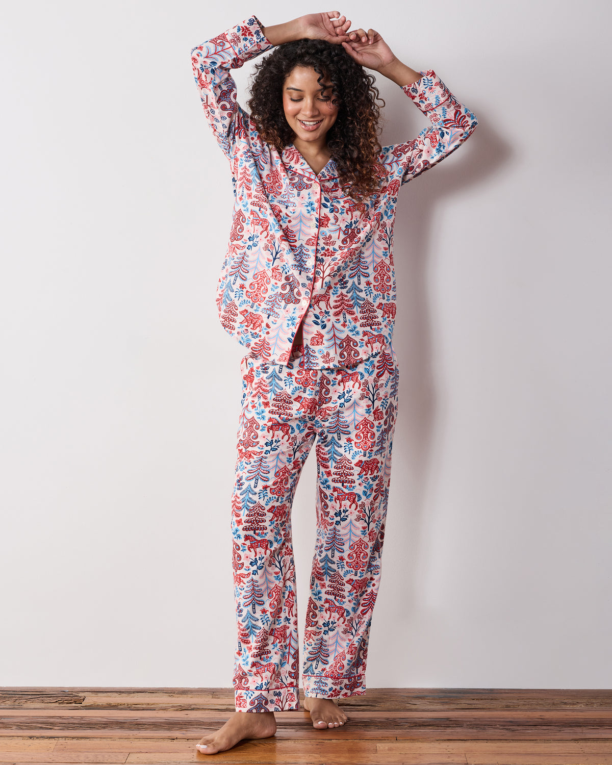 Full-length front view of the cream Folklore Forest long pajama set with matching button-front top and pants.