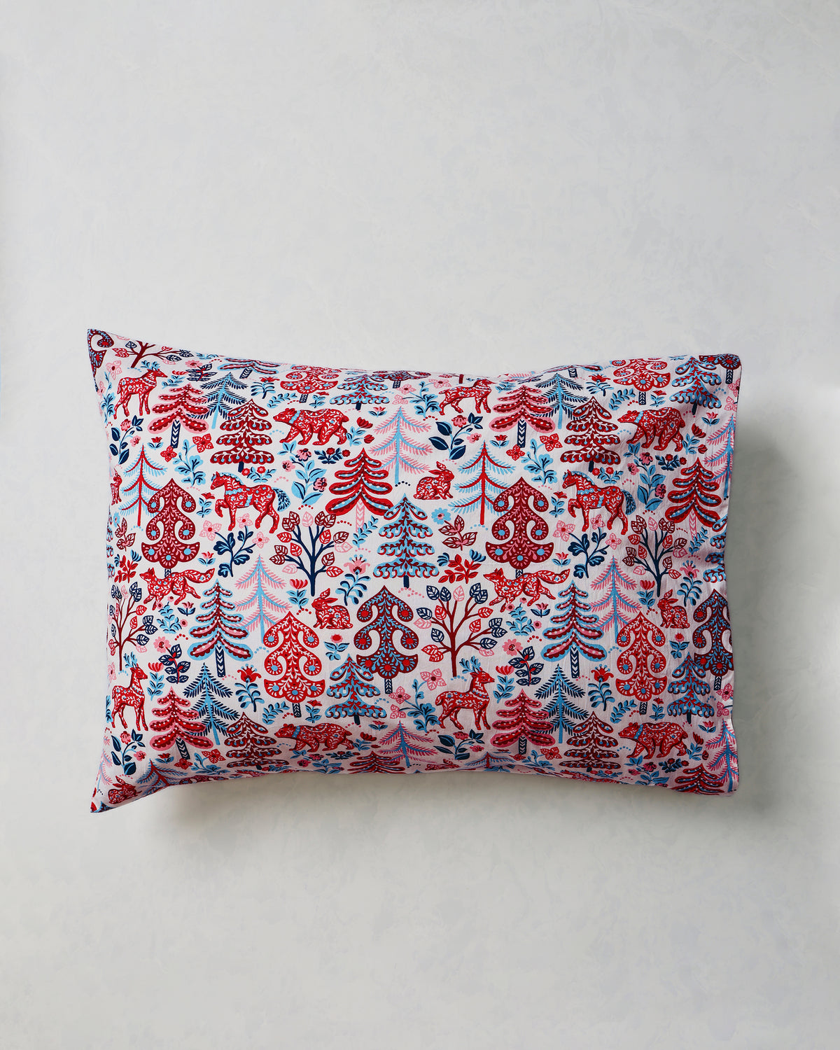 Single patterned pillowcase laid flat on a light background.