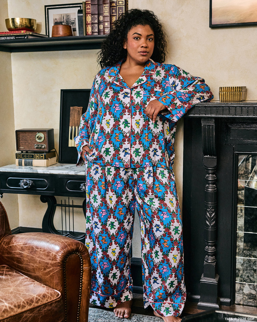 Full-length view of the Wandering Rose Palo Alto Soho set, showing a collared button-front top and wide-leg pants with a rose and dancing-bear print.