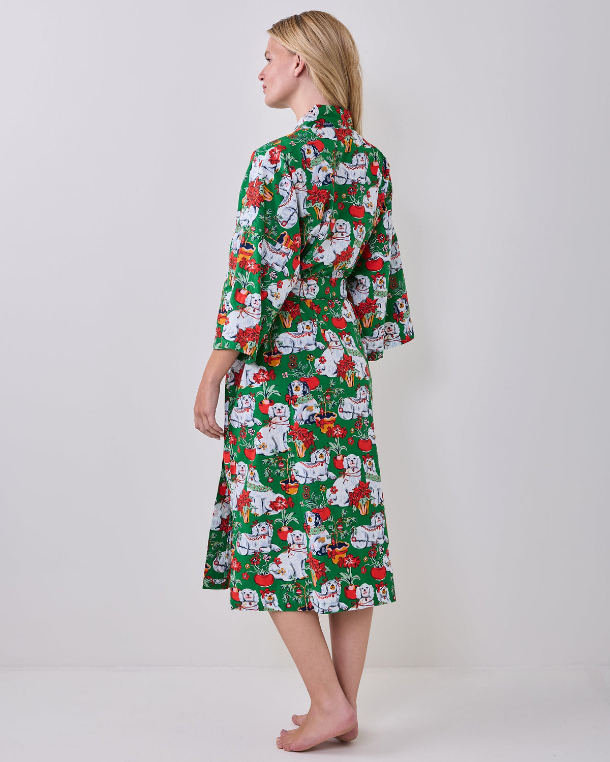 Back view of a person wearing the green printed long robe with a matching belt.