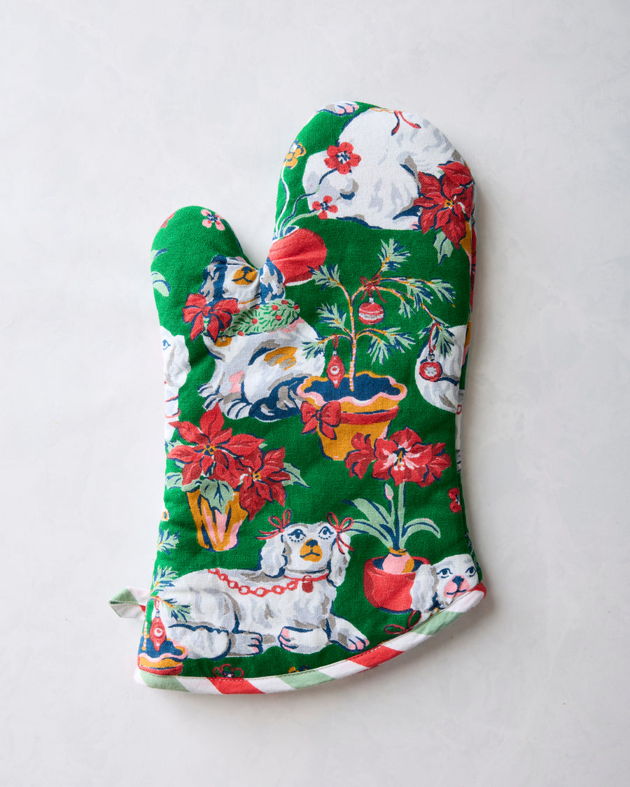 Back of the Good Dog Christmas oven mitt with dogs, flowers, potted plants, and ornaments
