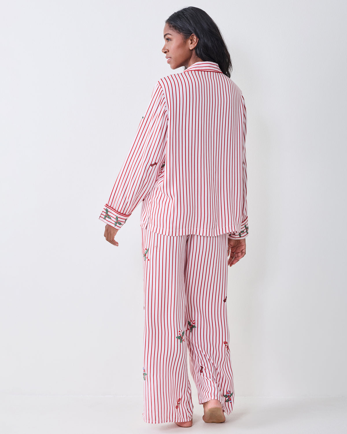 Back view of the red-and-white striped Ellie pajama set with embroidered motifs.