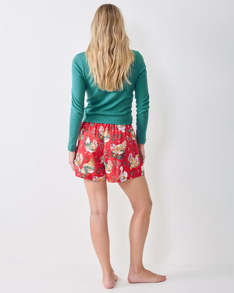 Back view of the red Holiday Hens boxer shorts, showing the rear fit and chicken-and-foliage print.