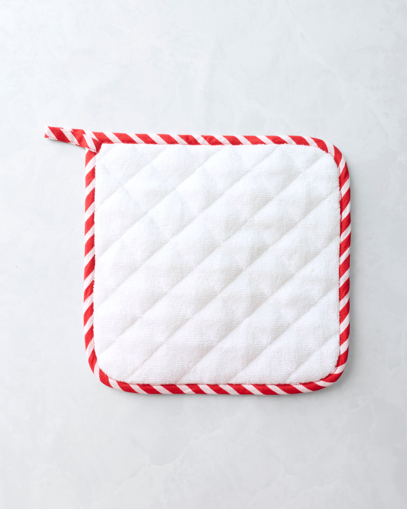 Back of a square pot holder with a white quilted surface, red-and-white striped binding, and a top hanging loop.