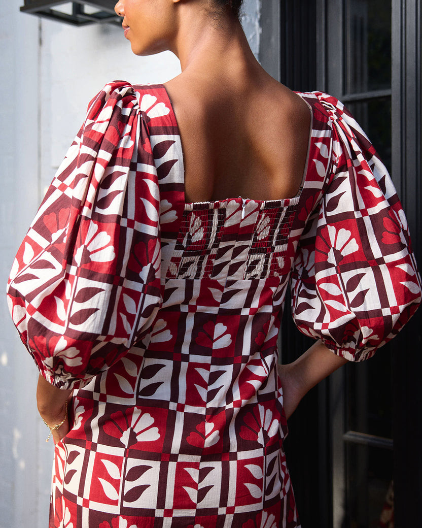 Close back view of the Constance dress showing the square neckline, gathered back panel, and puff sleeves.