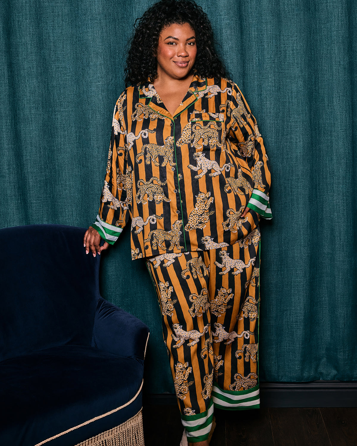 Full-length front view of a model wearing the Leopard Stripes Soho pajama set with matching leopard-print top and pants.