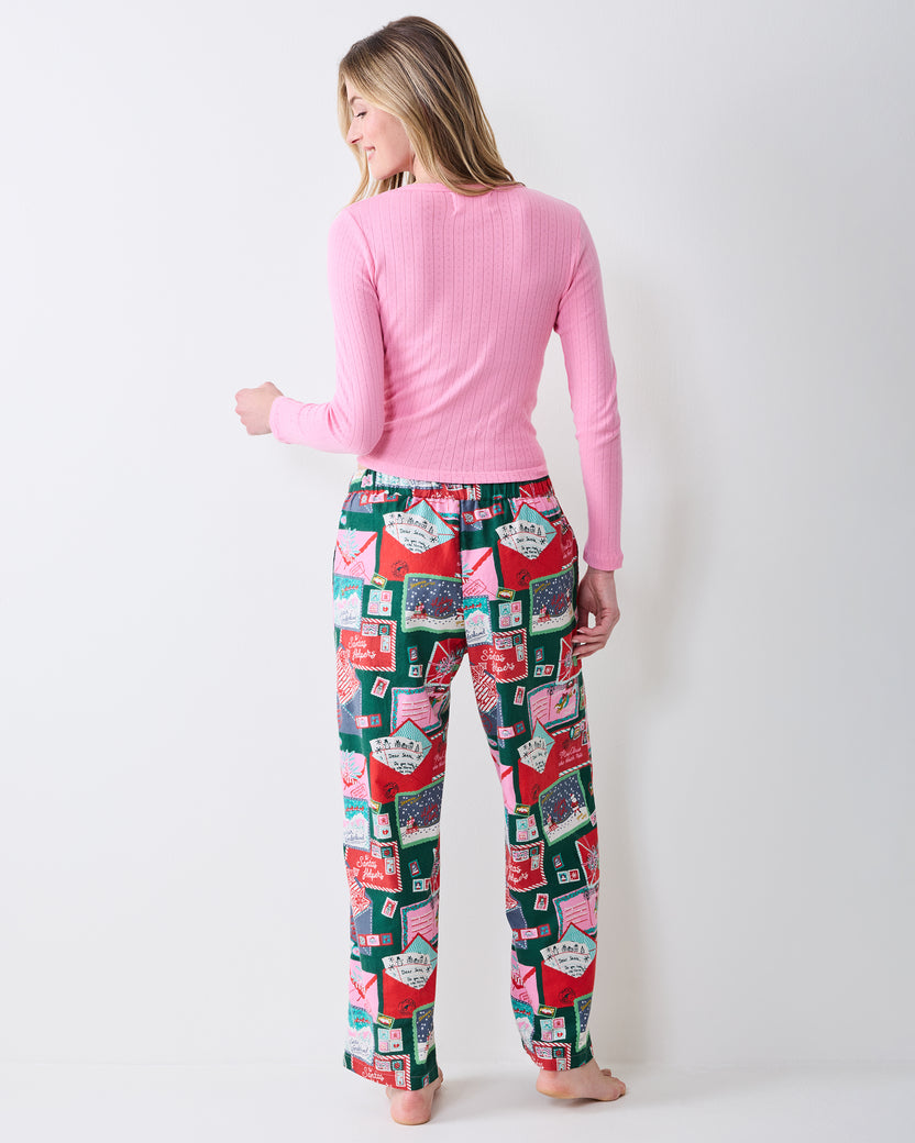 Back view of the printed Astrid pants showing the waistband, rear fit, and straight legs.