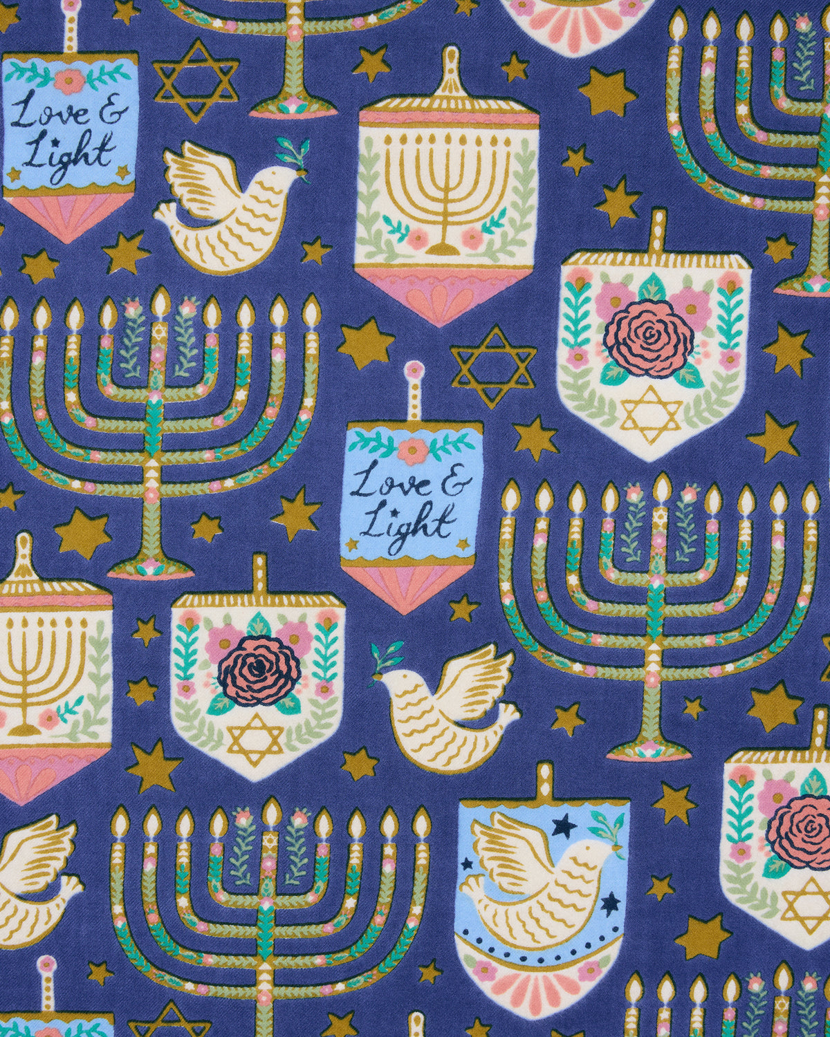 Hanukkah-themed blue tea towel print with menorahs, dreidels, stars, doves, and menorah-shaped ornaments.