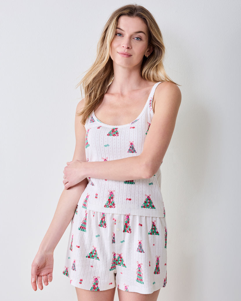 Three-quarter view of the buttercream Esme Set sleeveless top and matching shorts with a colorful macaron tower print.