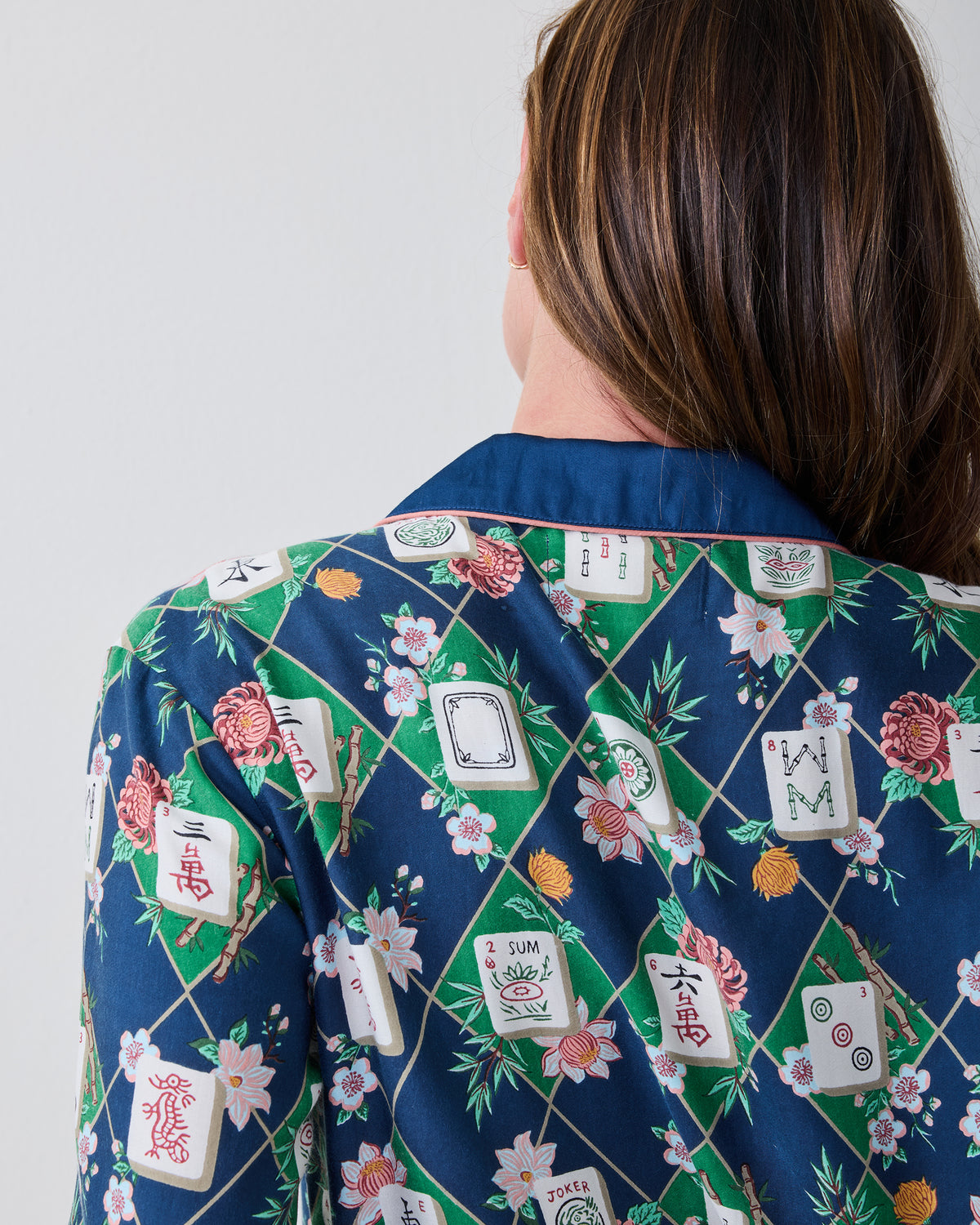 Close-up of the back collar and patterned fabric of the Mahj Garden Wintergreen Eco Satin Soho pajama top.