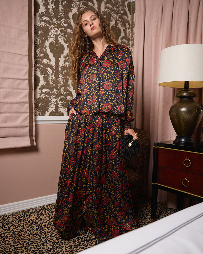 Full-length view of the Midwinter Bloom Drew blouse worn with a matching long skirt in an indoor setting.
