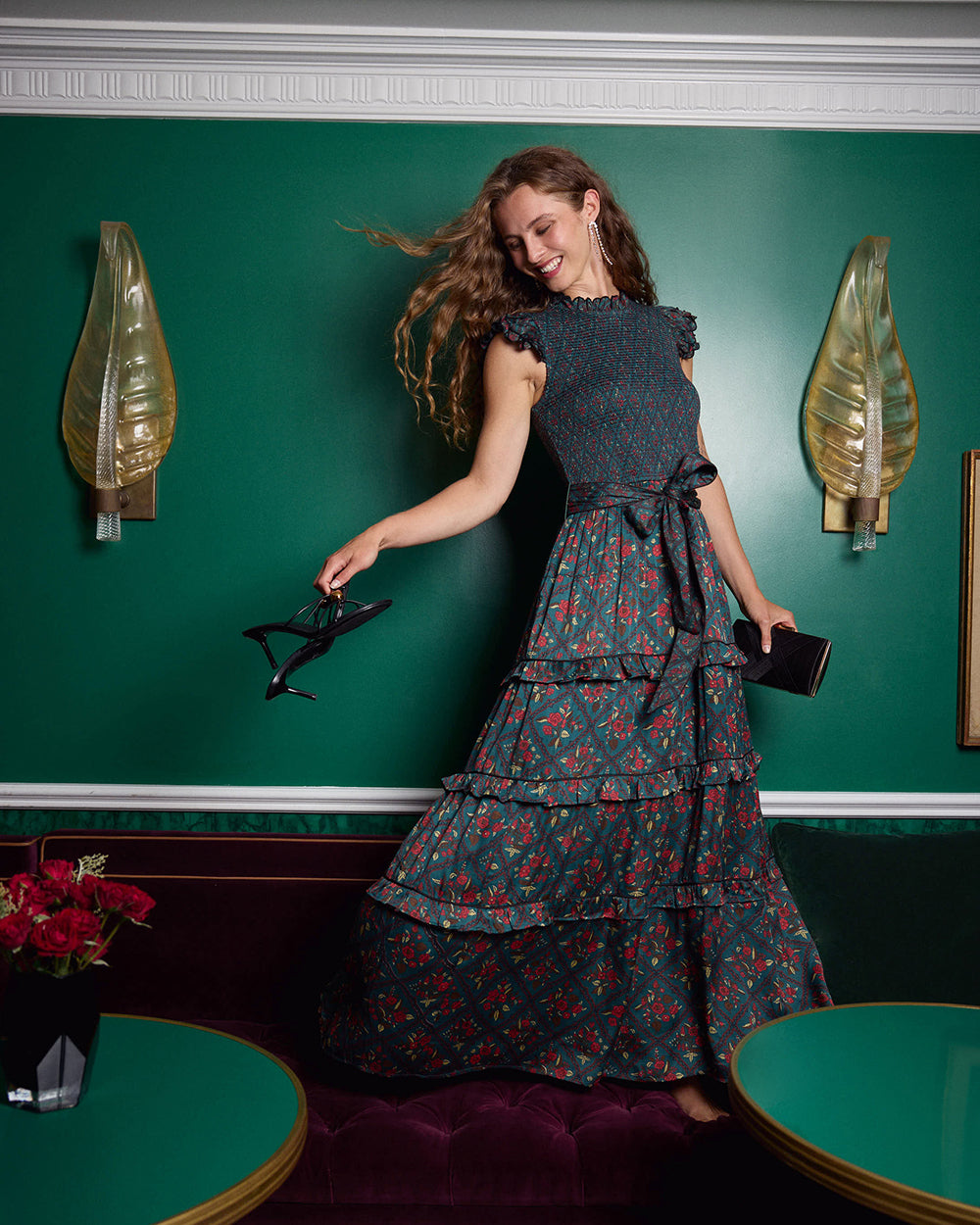 Person wearing the Ready to Ruffle Maxi, a tiered maxi dress with a tied waist and floral pattern.