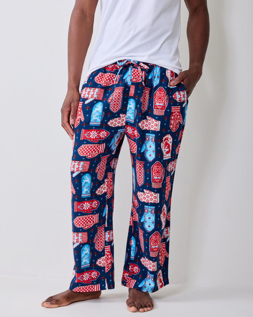 Front close-up of blue flannel men's pajama pants showing the mitten print, drawstring waistband, and side pockets.