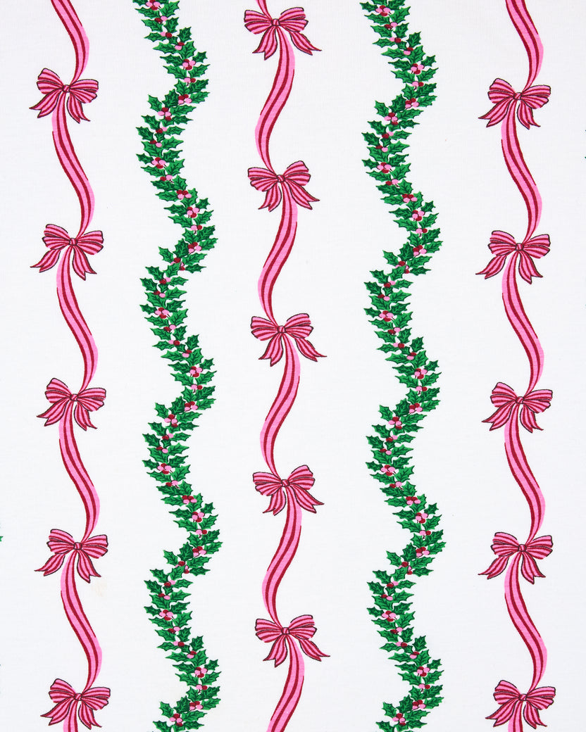 Flat view of the Ribbons & Bows Vanilla Cream print, showing repeated vertical green garlands and pink ribbon bows.