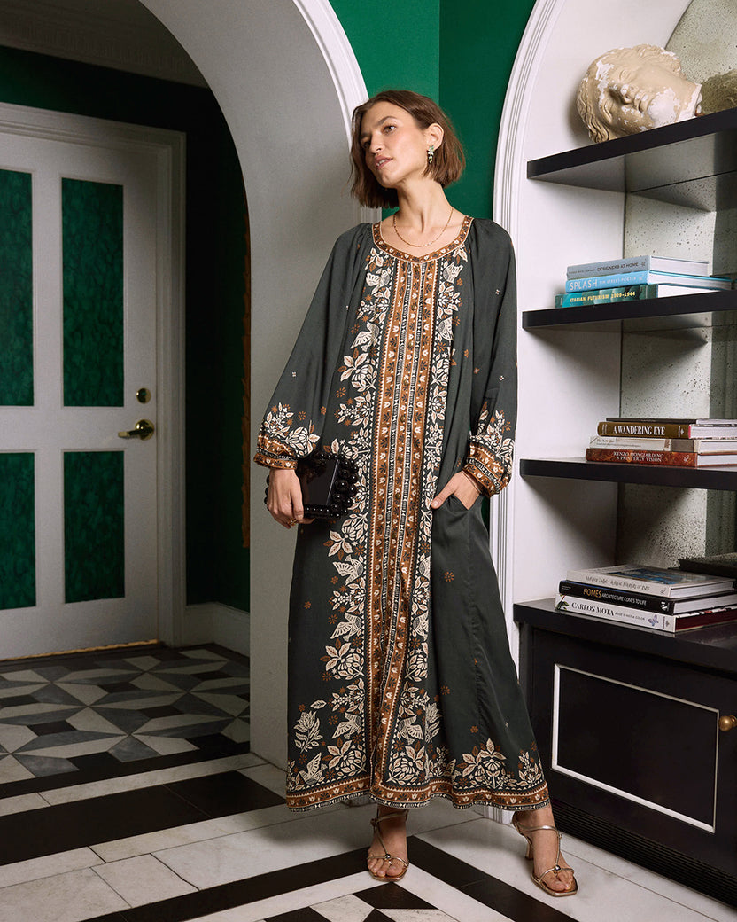 Full view of the Solstice Tapestry Hunter dress with long sleeves, a patterned center panel, and floral border detailing.