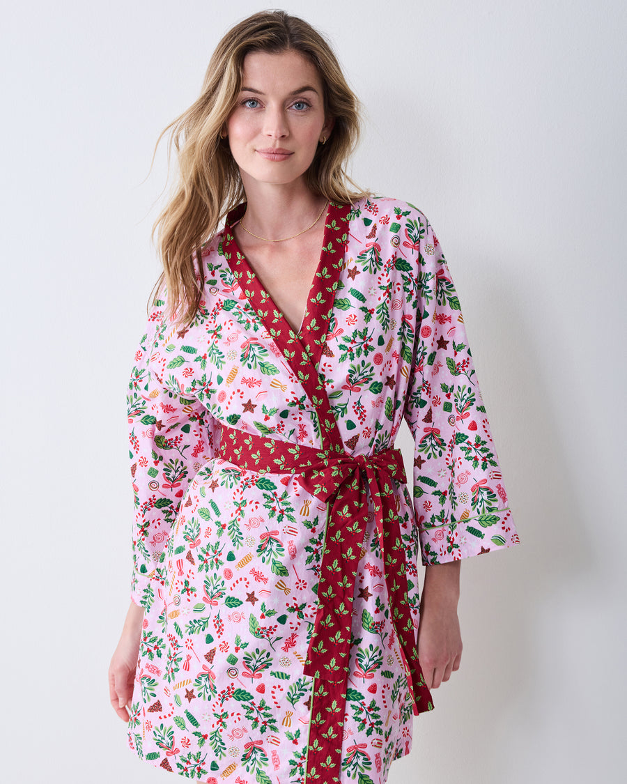 Front view of the Sweet Tooth Getting Ready Robe in Candy Pink, with a pink printed wrap robe, red contrasting trim, and a tied waist belt.