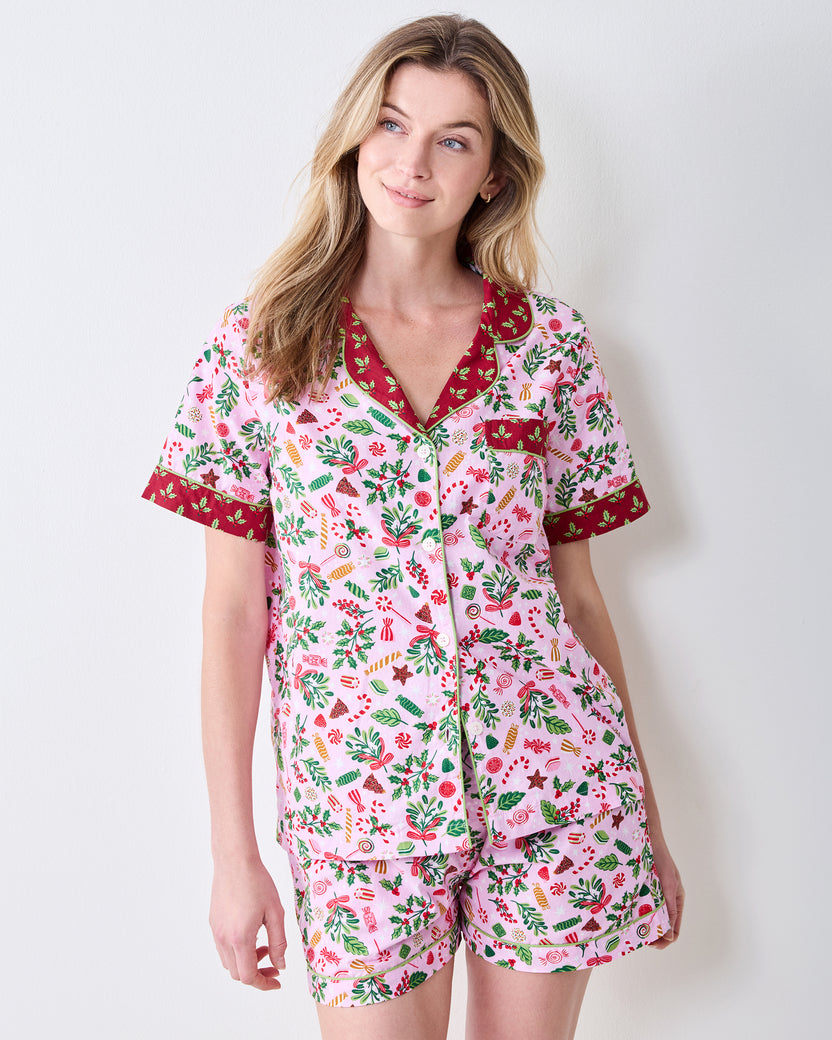 Front view of the Sweet Tooth Candy Pink short pajama set, showing a patterned button-front top with contrast collar and shorts.