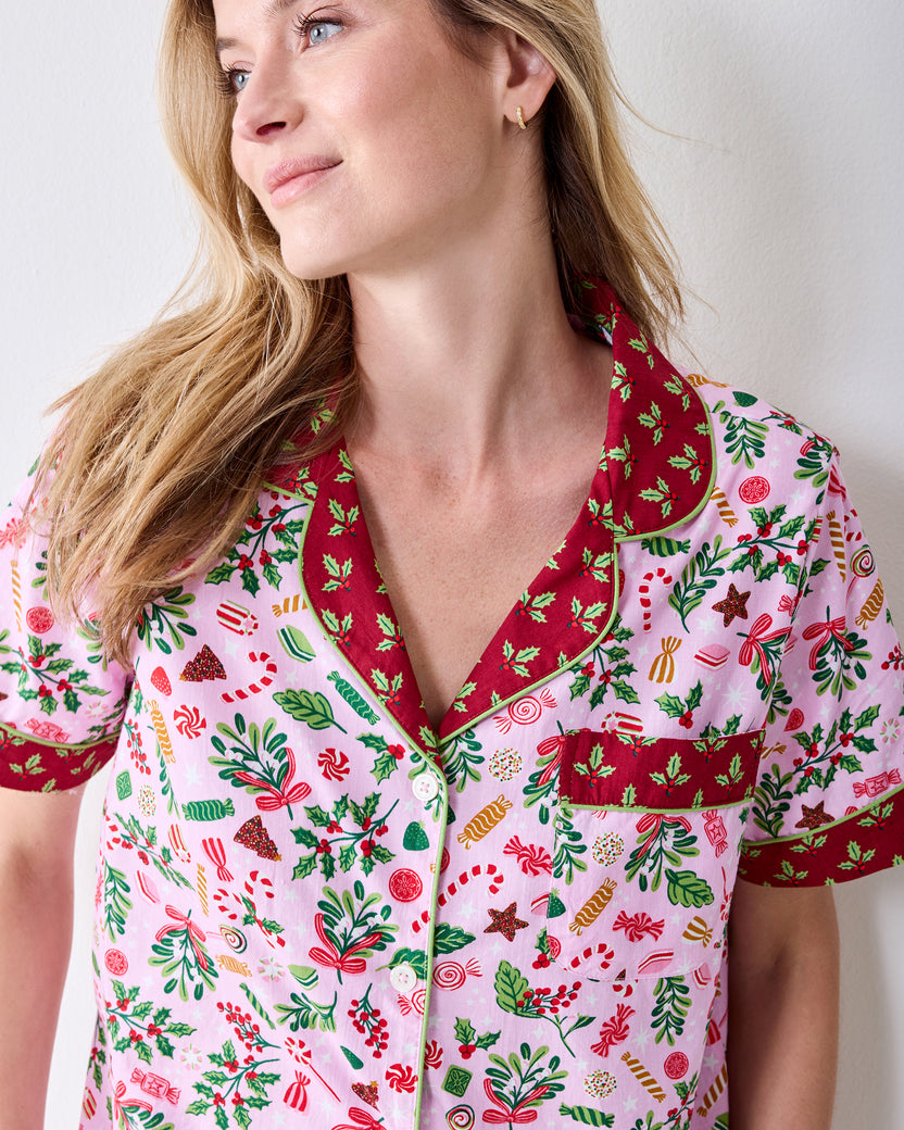Close front view of the Sweet Tooth Candy Pink pajama top, showing the contrast collar, chest pocket, buttons, and patterned print.