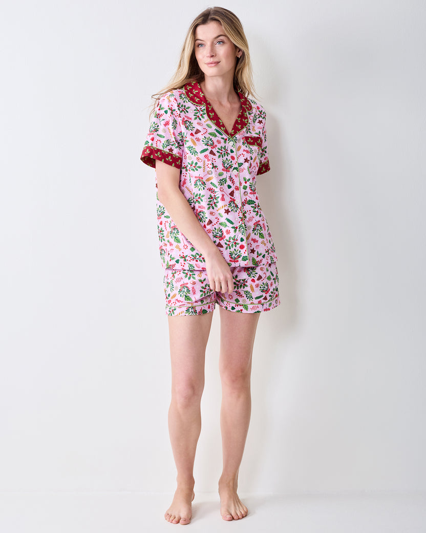 Full front view of the Sweet Tooth Candy Pink short pajama set on a person, showing the matching button-front top and shorts.