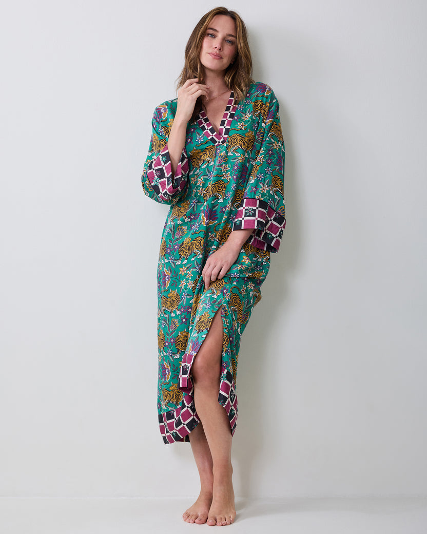 Front view of the Royal Teal Kennedy caftan with a V-neckline, long sleeves, front slit, and contrasting checkered trim.