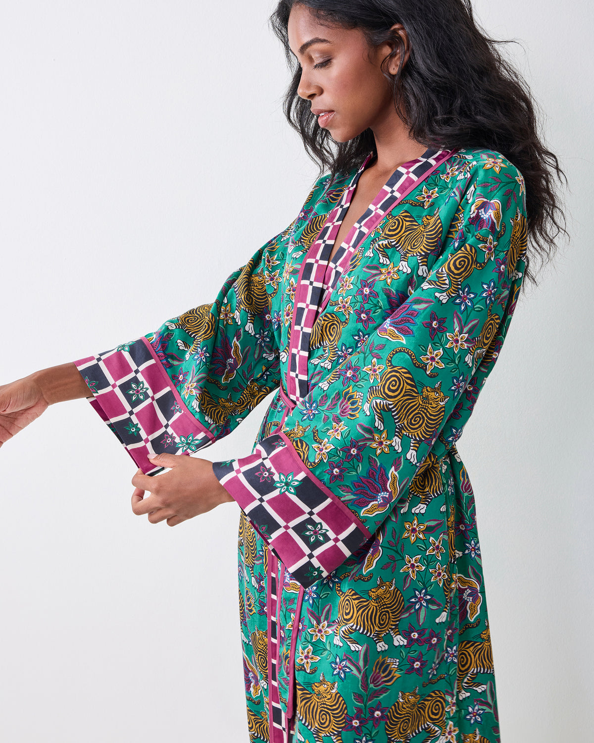 Side view of the Royal Teal Tibetan Tigress Eco Satin Robe tied at the waist, showing wide checkered cuffs.