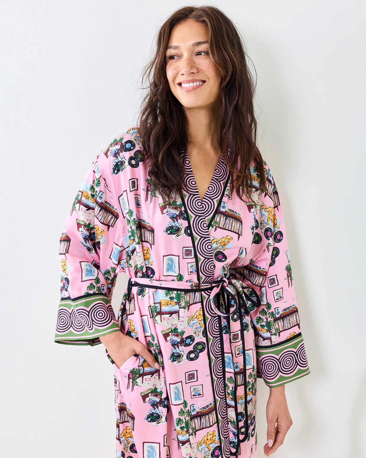 Close view of the pink Vinyl Collector robe showing its patterned collar, matching belt, and printed design.