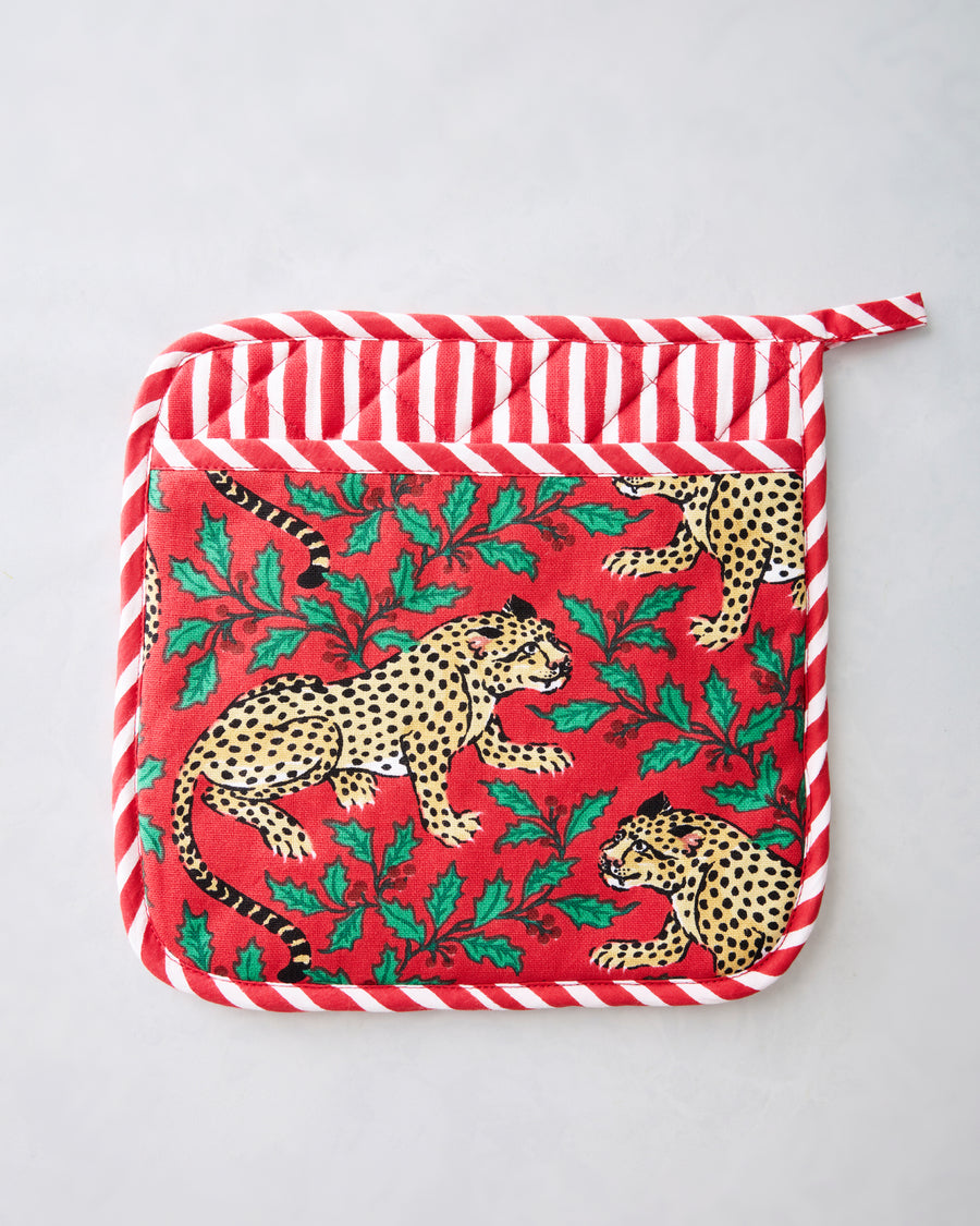 Ruby pot holder with a leopard-and-holly print and red-and-white striped trim.