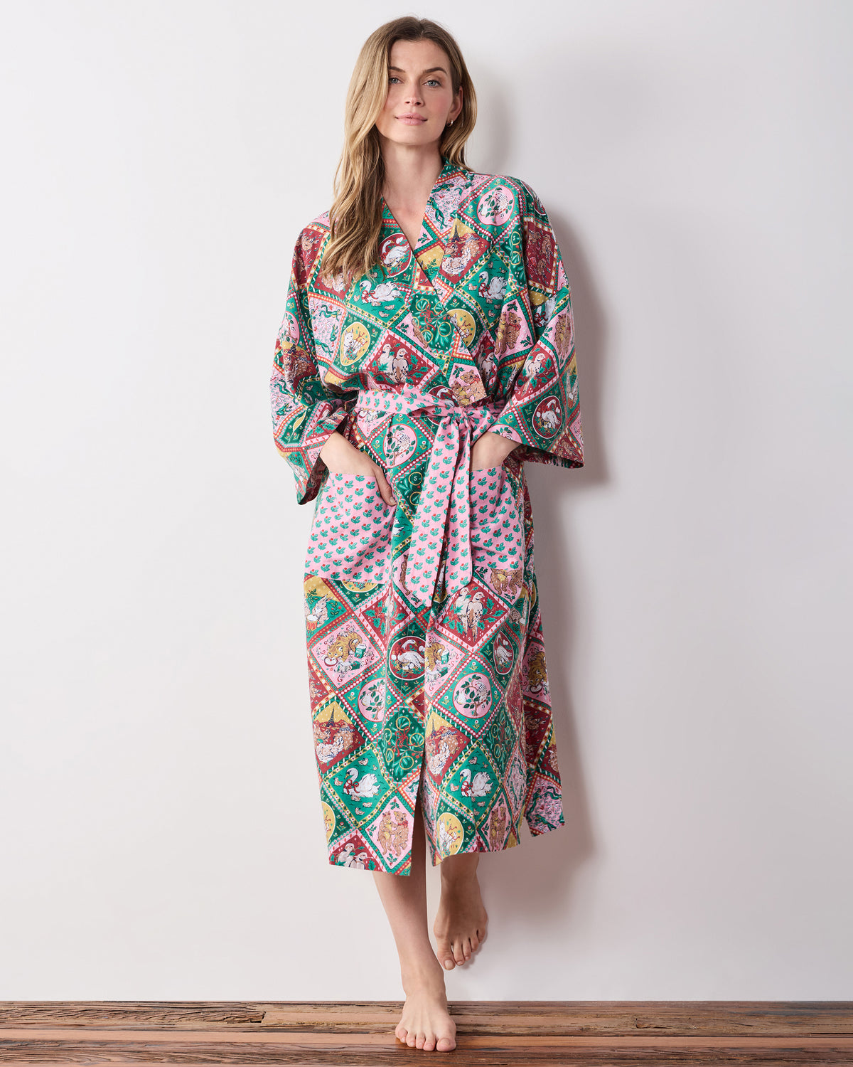 Full-length front view of a person wearing the printed long robe with a tied sash and front pockets.