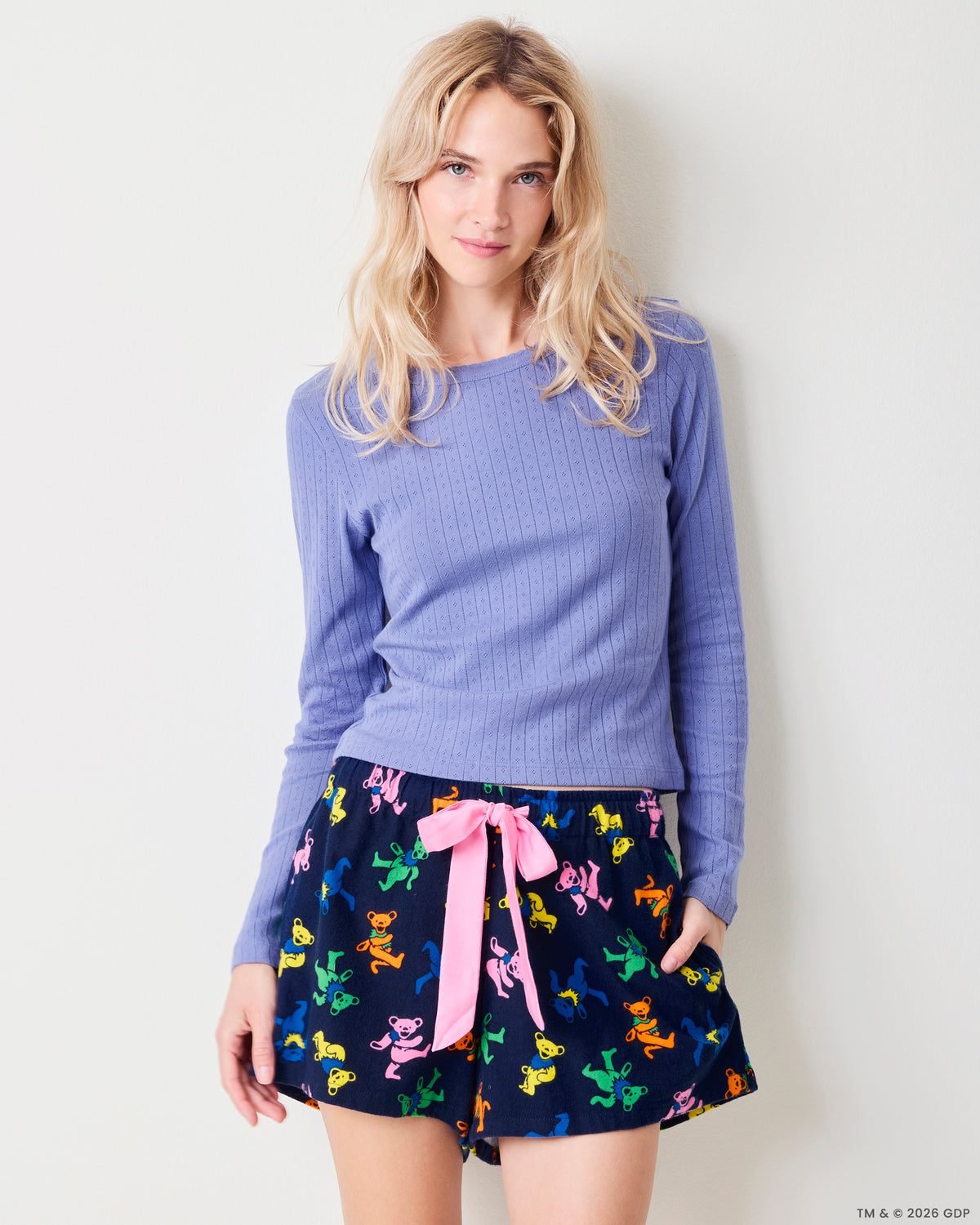 Front view of the Dancing Bears Astrid shorts with a colorful bear print, pink drawstring, and side pockets.