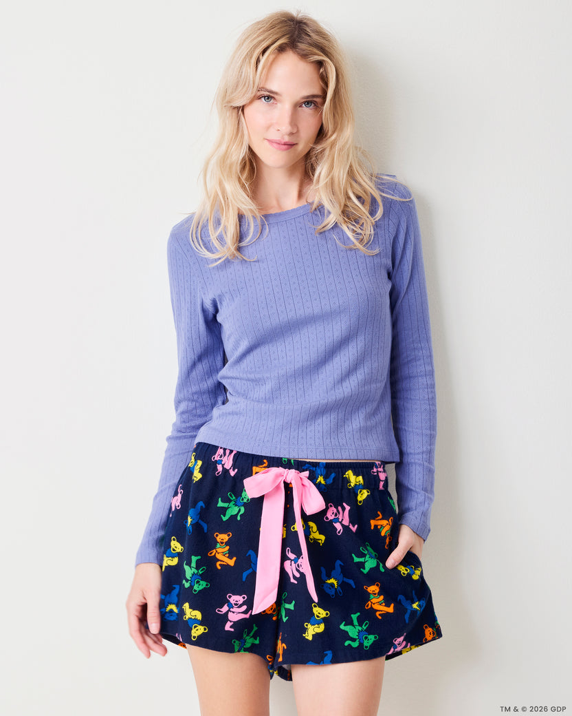 Front view of the Dancing Bears Astrid shorts with a colorful bear print, pink drawstring, and side pockets.