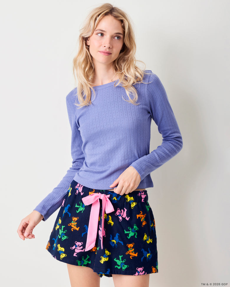 Three-quarter front view of the Dancing Bears Astrid shorts showing the colorful bear print and pink drawstring.
