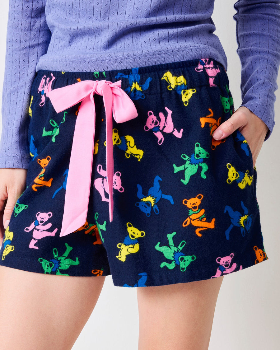 Front view of the Dancing Bears Astrid shorts showing the colorful bear print, pink drawstring, and side pockets.
