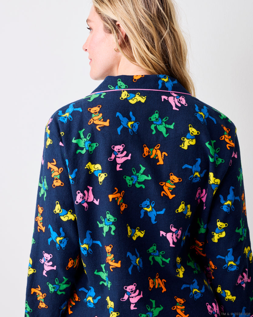 Back view of a navy Dancing Bears pajama shirt covered in colorful bear prints, with pink piping across the collar.