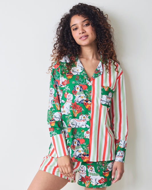 Front view of the Good Dog Christmas boxer pajama set with a long-sleeve split-print top and coordinating shorts featuring stripes and dog-and-poinsettia motifs.
