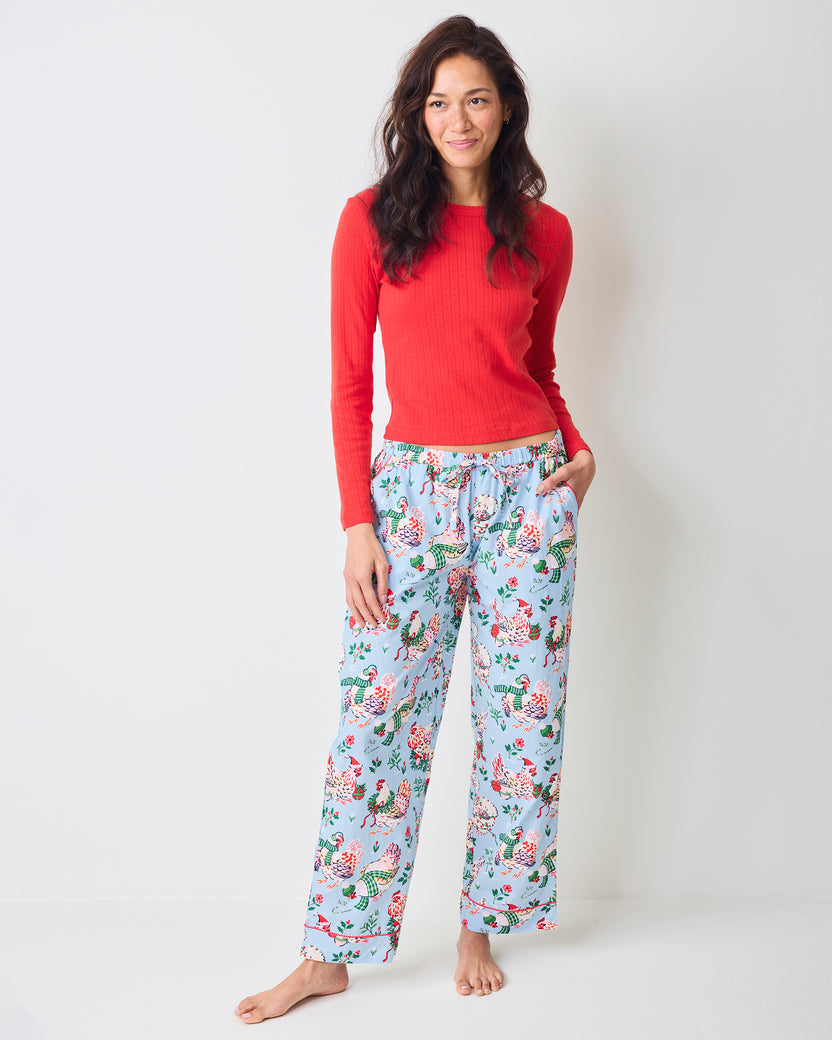 Front view of pale blue Holiday Hens full-length pajama pants with an elastic drawstring waistband and repeated hen print.