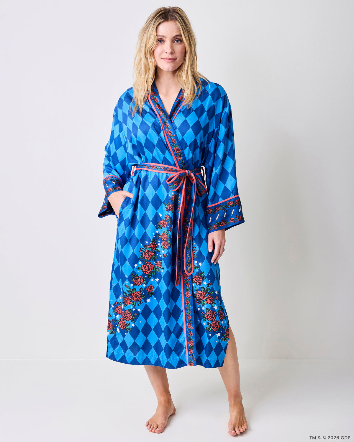 Front view of the blue patterned Eco Satin Robe with rose-and-star trim, wide cuffs, tied belt, and side pockets.