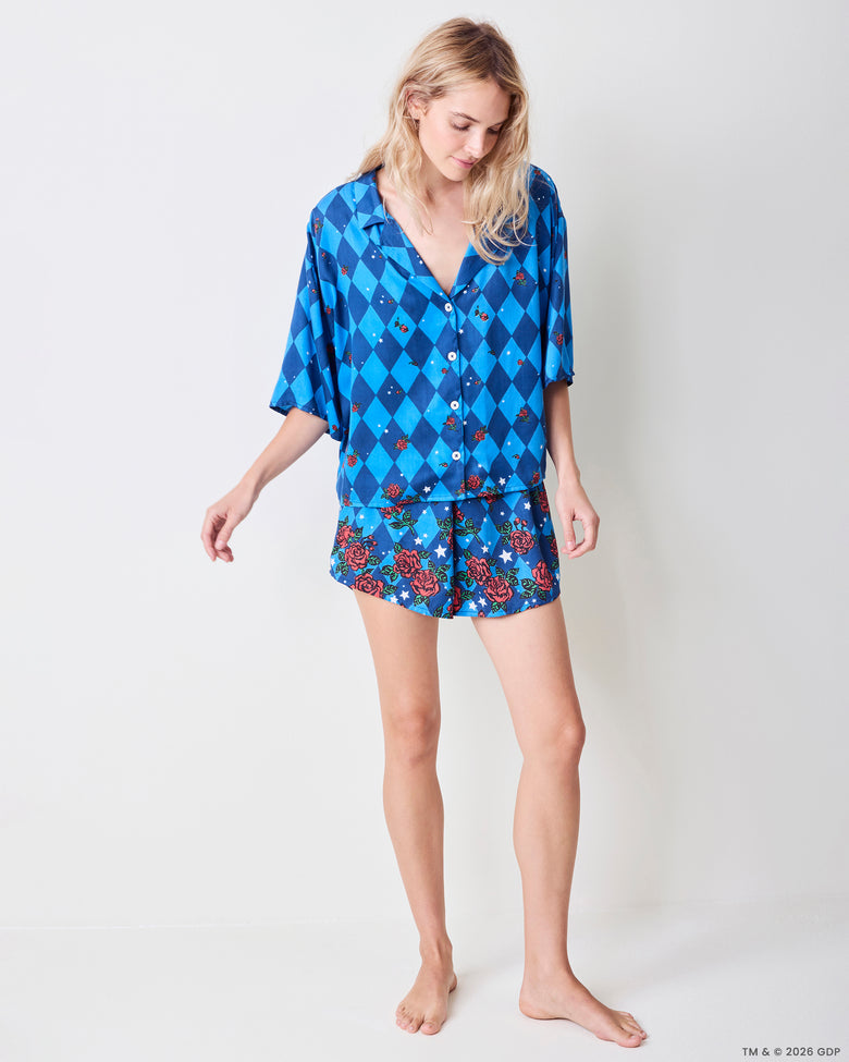Front view of the blue patterned Sweet Dreams Set, showing the button-front top and matching rose-and-star print shorts.