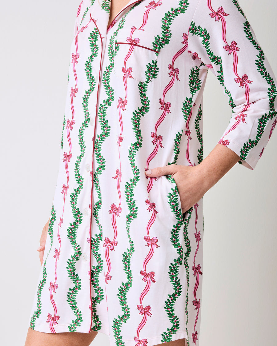 Close-up side view of the Ribbons & Bows sleep shirt, showing the chest pocket, button front, side pocket, and printed pattern.