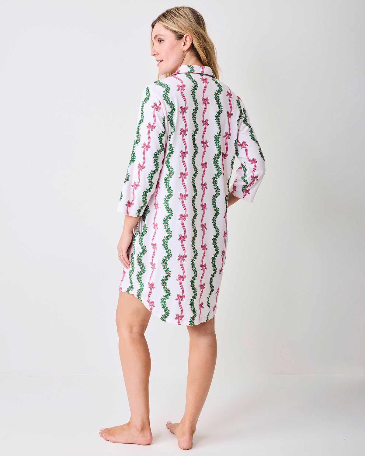 Back view of the Ribbons & Bows sleep shirt, showing its button-down shirt shape, three-quarter sleeves, and continuous pink and green print.