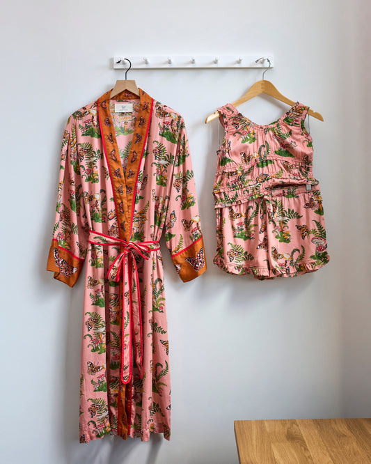 Butterfly Forager printed robe and ruffle-trimmed short set hanging side by side.
