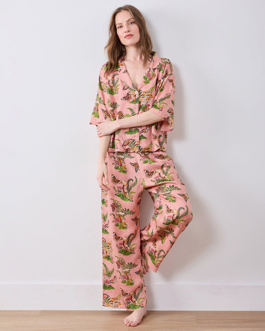 Full-length front view of the pink Butterfly Forager tall satin Wildest Dreams pajama set with a short-sleeved top and wide-leg pants.