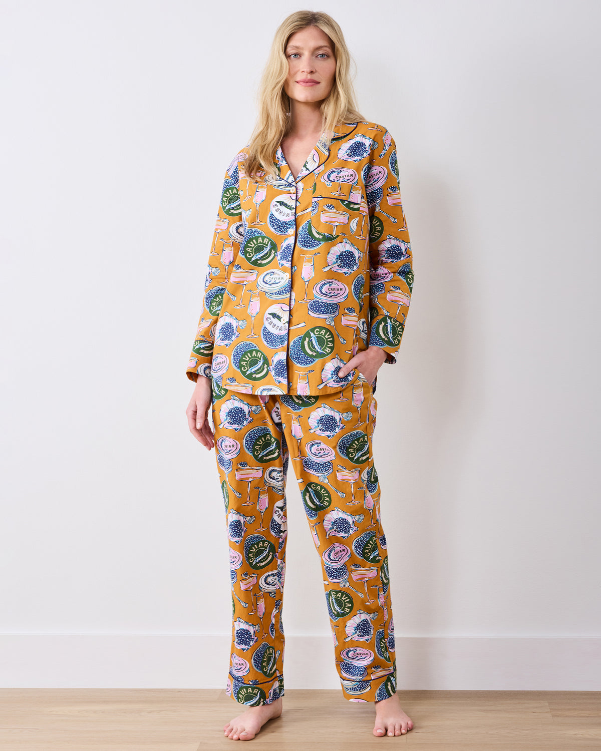 Full-length front view of the goldenrod Champagne & Caviar long pajama set with a button-front top and matching pants.