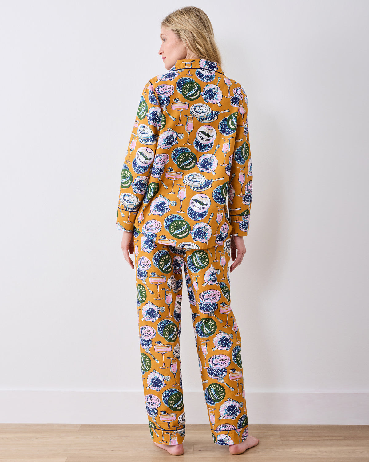 Full-length back view of the goldenrod Champagne & Caviar long pajama set with matching long-sleeve top and pants.